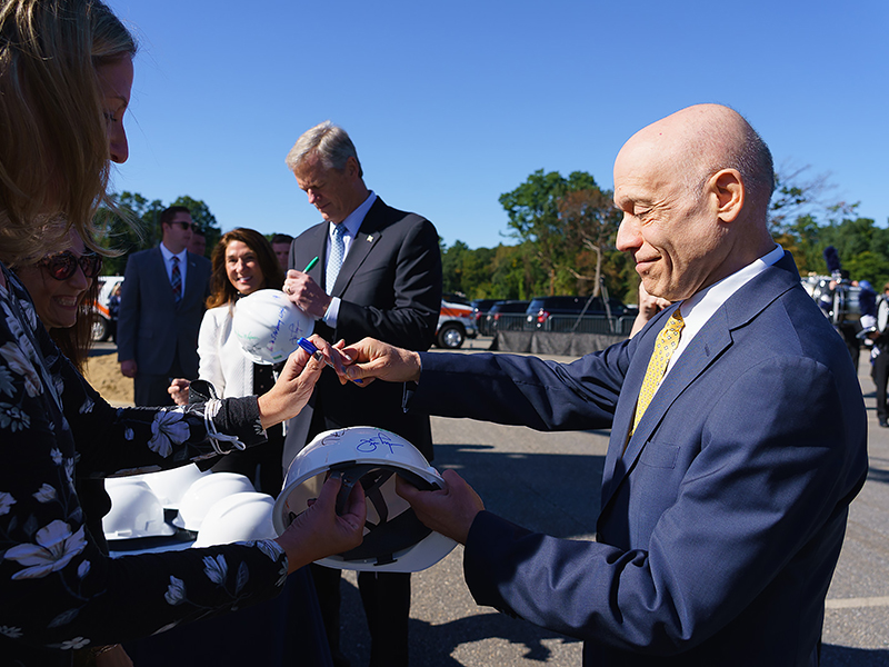 President Podell and Governor Baker sign hard hats
