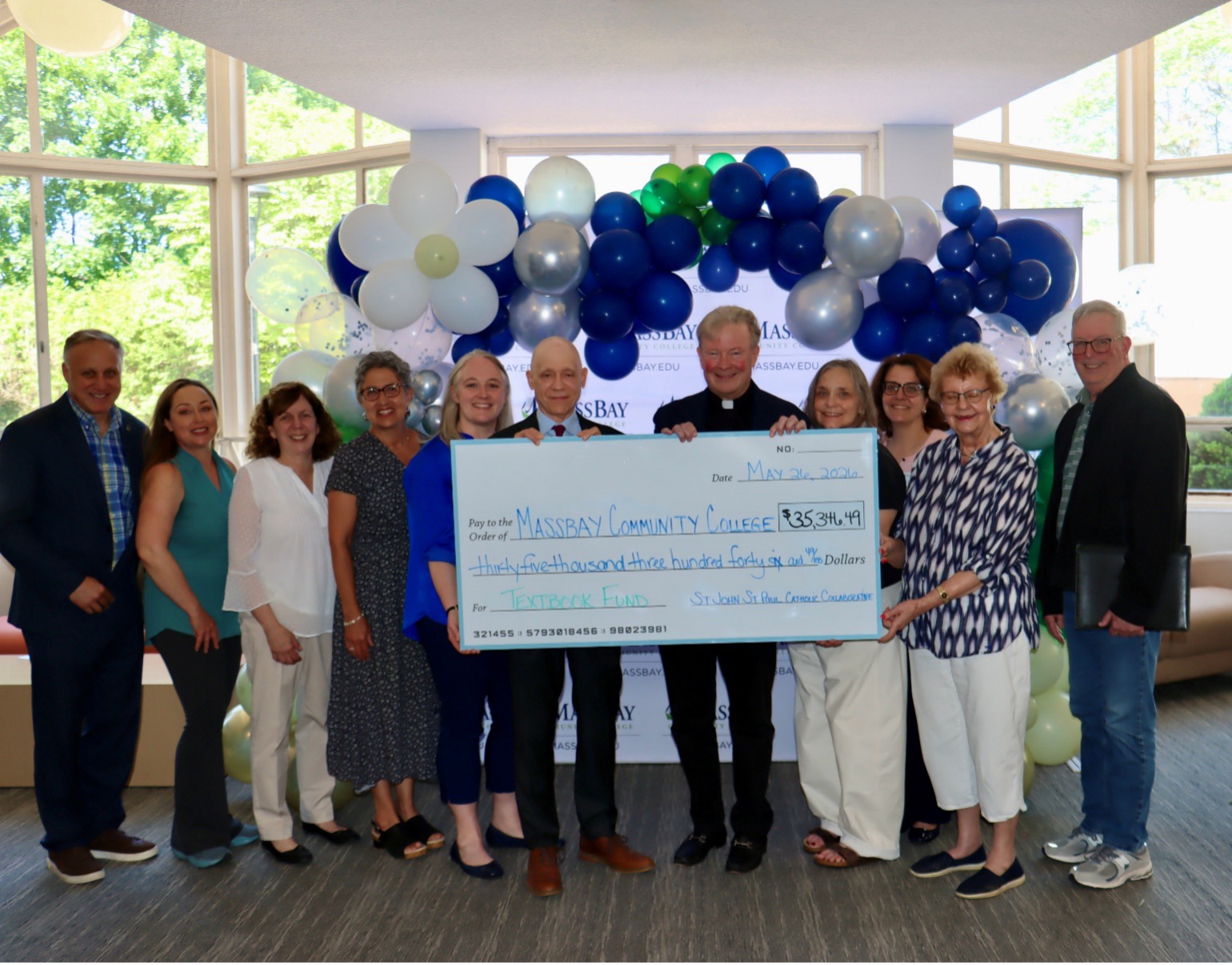 Check from St John St Paul Catholic Collaborative presented to MassBay Community College to fund textbooks