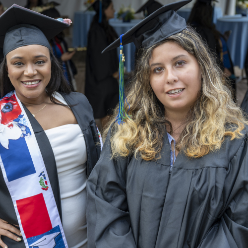 Two female graduates, MassBay Community College Class of 2026