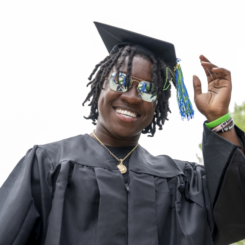 Happy Graduate Moving Tassel to Left, MassBay Commencement 2026