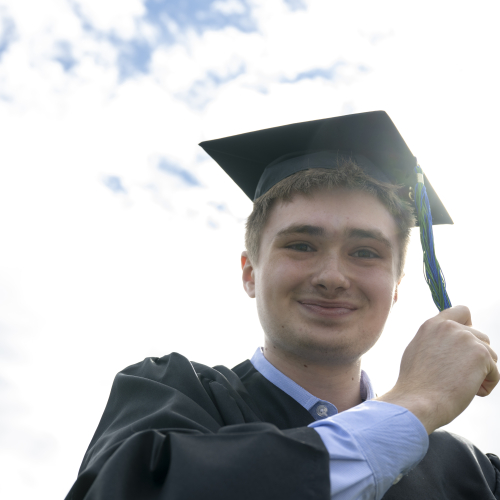 Student with tassel on left at the end of MassBay Commencement 2026