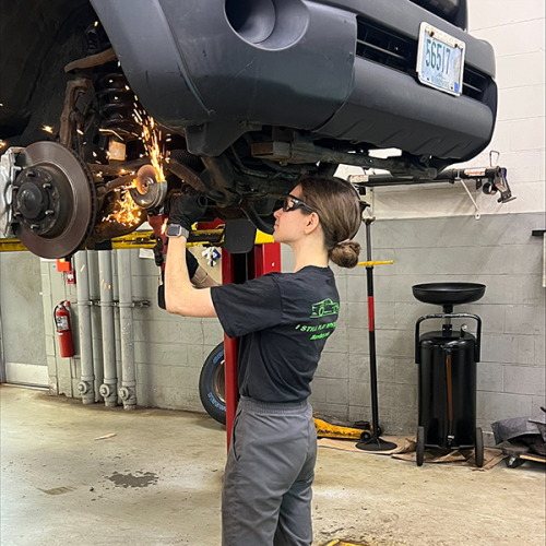 Automotive Tech student Daria Litouka working on car