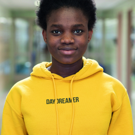 Image of MassBay student wearing sweatshirt that says Day Dreamer