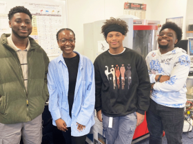 MassBay Community College students (left to right) Reginald Ben Arthur Jr., Esther Jagwer, Leo Russell, and AJ Gilbert Miller, pose in the engineering lab on the Wellesley Hills campus, Wellesley Hills, MA, February 2024 (Photo/MassBay Community College).
