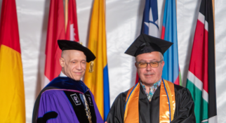 MassBay President Dr. David Podell gives diploma to Arthur Nigro
