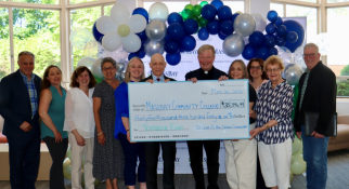 Check from St John St Paul Catholic Collaborative presented to MassBay Community College to fund textbooks