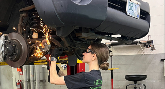 Automotive Tech student Daria Litouka working on car
